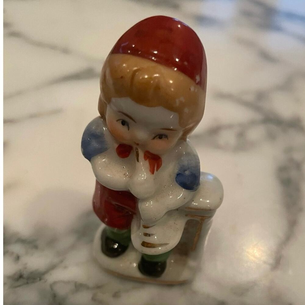 Occupied Japan-porcelain recreation of little boy with a horn/bugle. A05